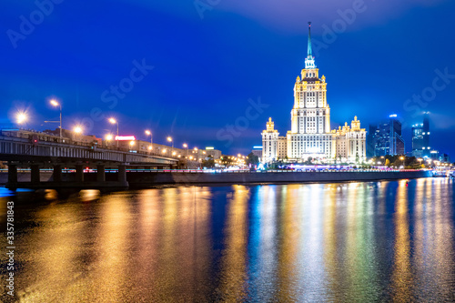 Moscow. Stalin s high-rise buildings. Hotel Ukraine. Evening in Moscow. Reflection of light of lanterns in the river Moscow. Business card of the capital of Russia. Architectural masterpiece.