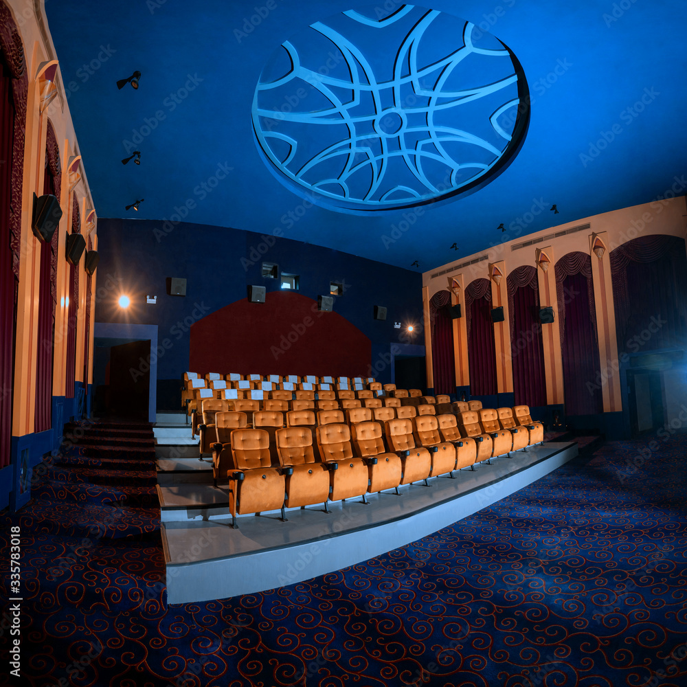 Large cinema theater interior with seat rows for audience to sit in movie theater premiere by