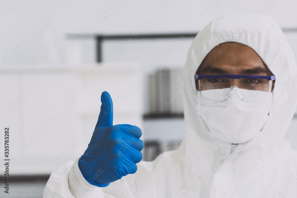 Lab Technician in Personal protective equipment PPE suit Good hand gesture Lab Technician in Personal protective equipment PPE suit Good hand gesture