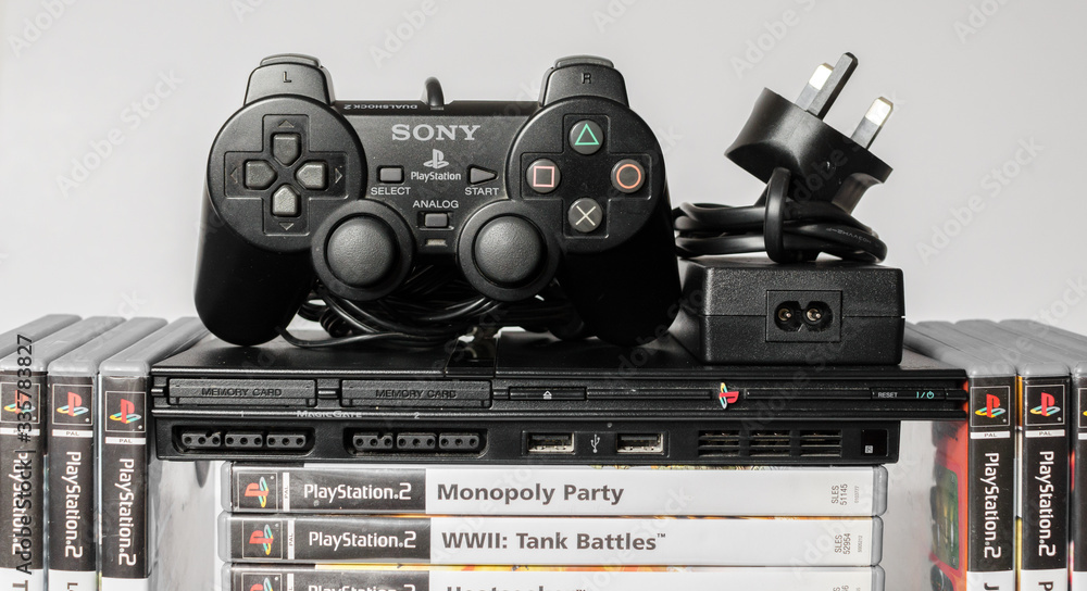 london, england, 07/05/2018 An original slim black sony playstation 2  console with games and controls. PS2 retro video game console. clean  immaculate vintage console. Sonys game hardware unit isolated Stock Photo |  Adobe Stock