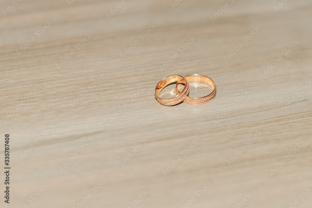 Wedding rings lie on the floor Wedding rings lie on the floor