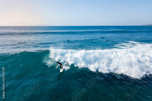 Surfer at the top of the wave