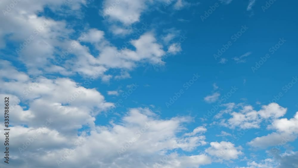 Time lapse view of approaching clouds and blue sky on a bright sunny day Time lapse view of approaching clouds and blue sky on a bright sunny day
