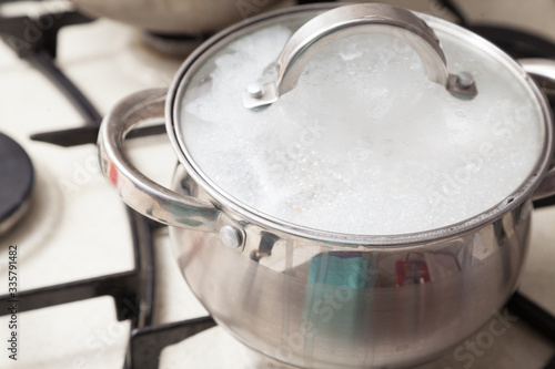 Closeup of cooking pot with boiling soup