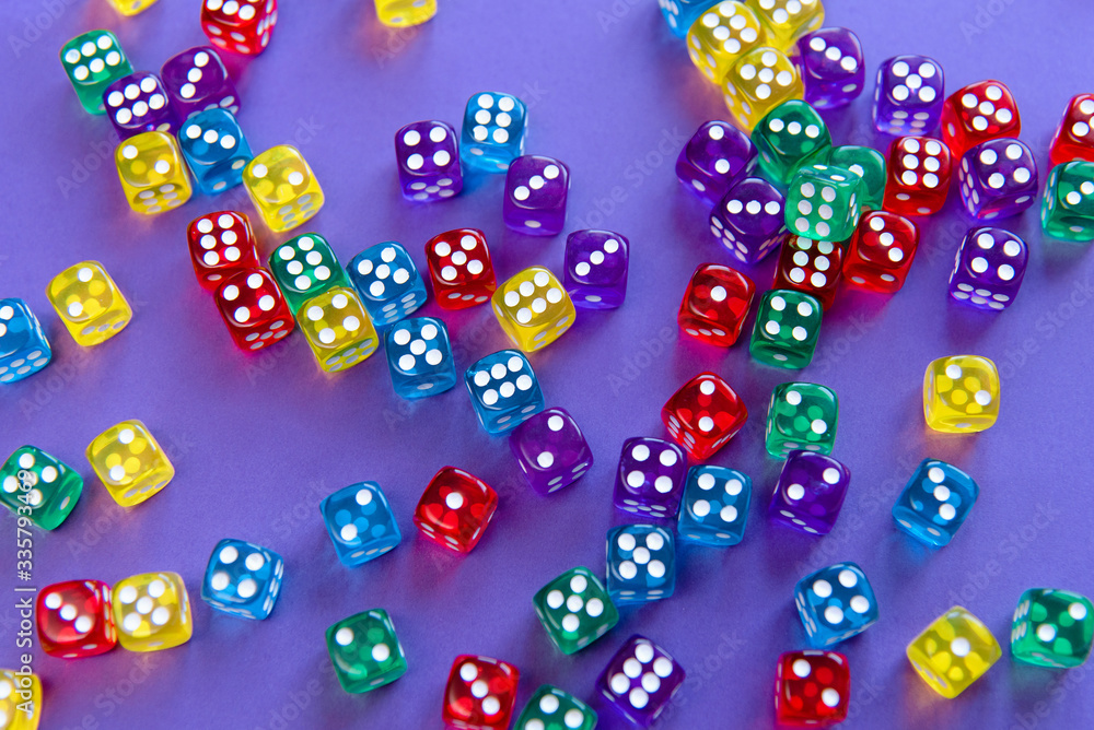 Colorful dice set on violet background Colorful dice set on violet background