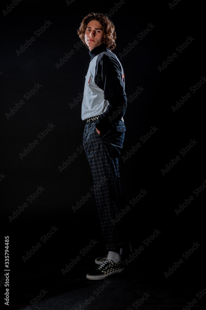 Trendy young guy posing in studio Trendy young guy posing in studio