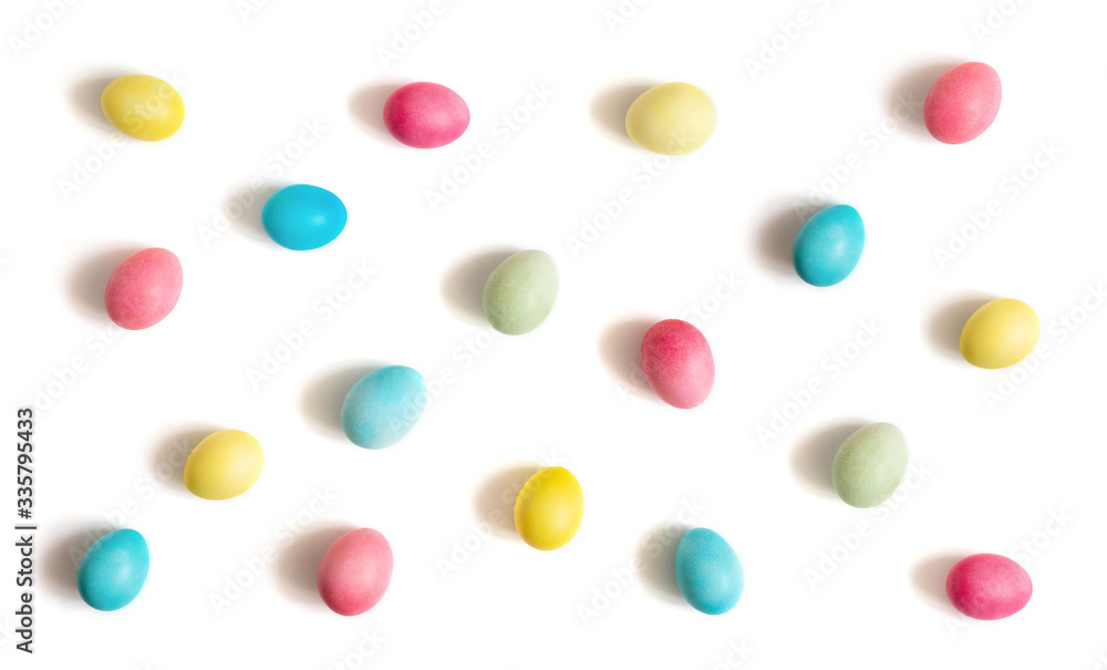 Colorful Easter chicken eggs on a white background. Easter egg pattern. Colorful Easter chicken eggs on a white background. Easter egg pattern.