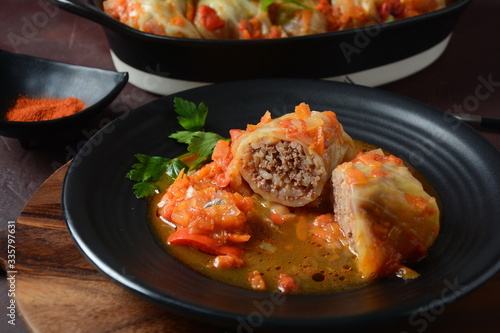 Cabbage rolls stuffed with ground beef and rice in tomato sauce