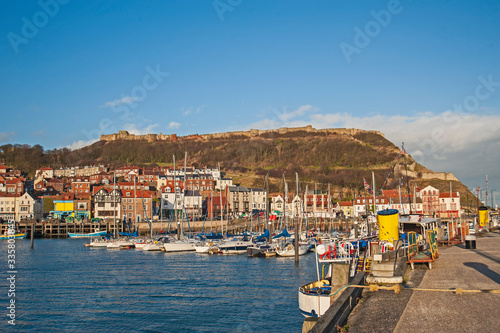 Seaside town with harbor marina and castle