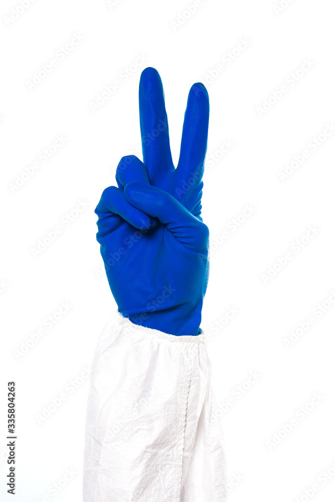 Obraz premium Doctor's or nurses hands in navy gloves making peace sign with hands isolated on white background