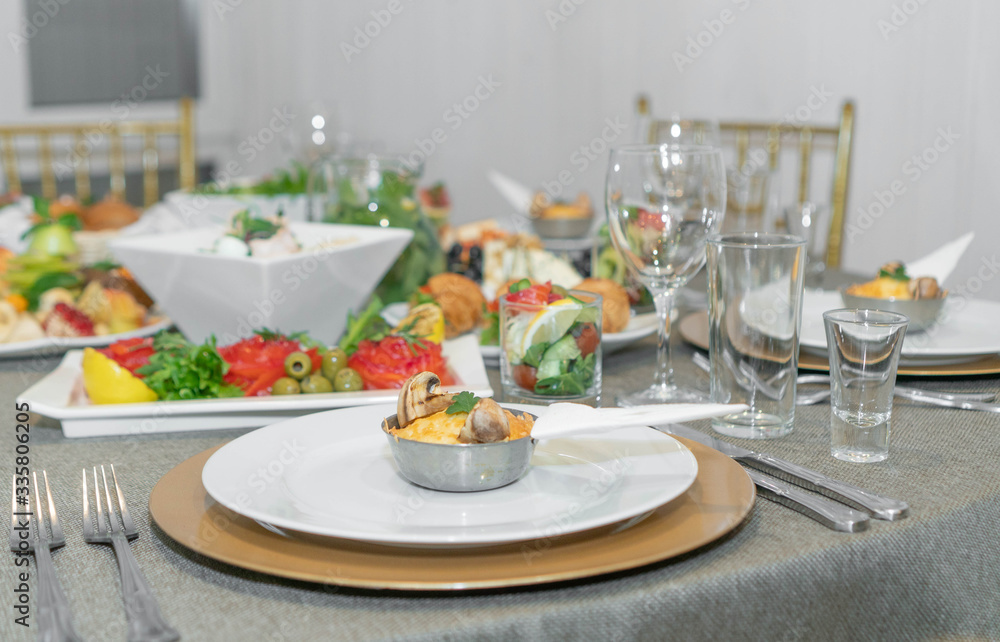 Dining table full of food served with light dishes
