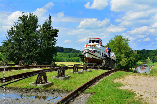 Mechanical equipment for transporting boats, boat moored to the shore on the Elblag Canal, Poland