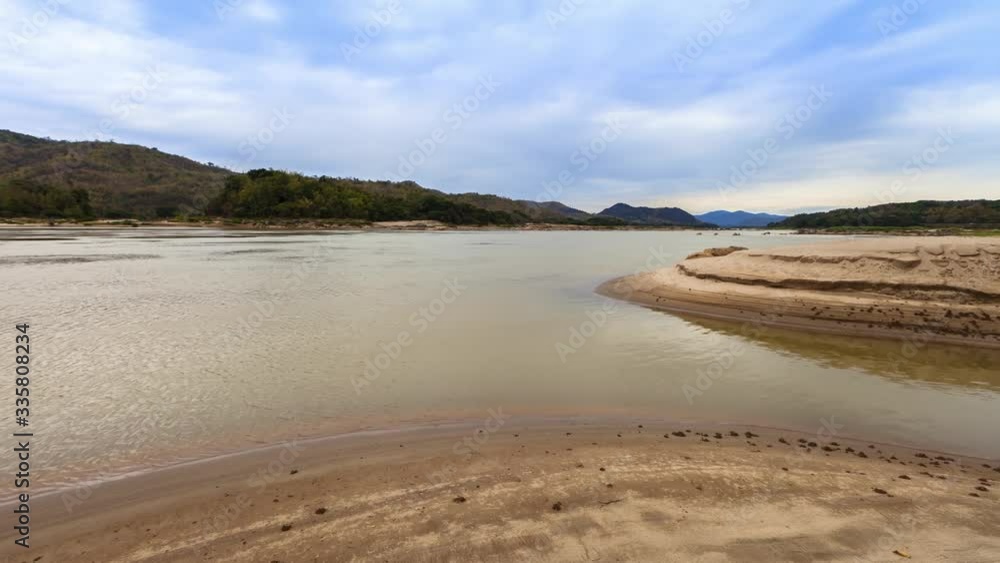 Khong River under cloudy sky acorss mountain separated Thai and Laos country location at north east of thailand Khong River under cloudy sky acorss mountain separated Thai and Laos country location at north east of thailand