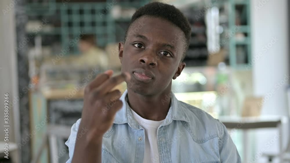 Portrait of Abusive Young African Man showing Middle Finger