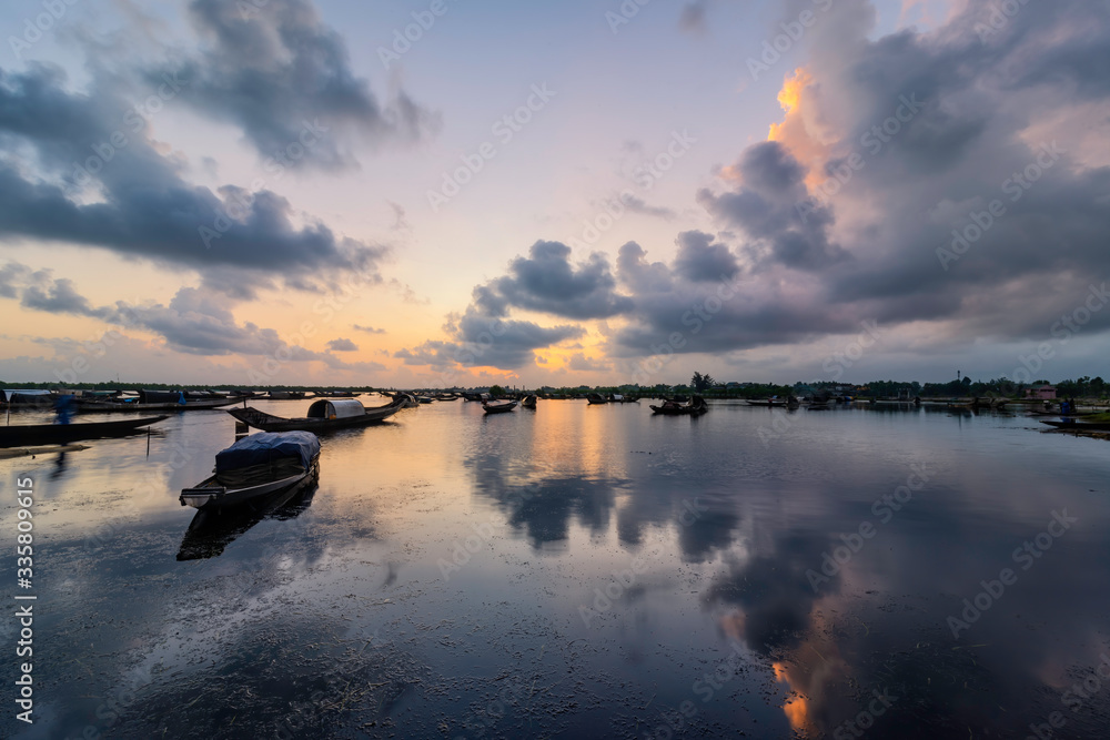 Boats in Tam Giang lagoon in sunrise in Hue, Vietnam