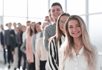 background image of a group of diverse people standing in line