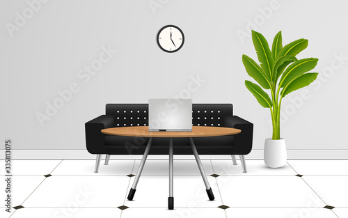 notebook on the wooden table and black sofa in the work room