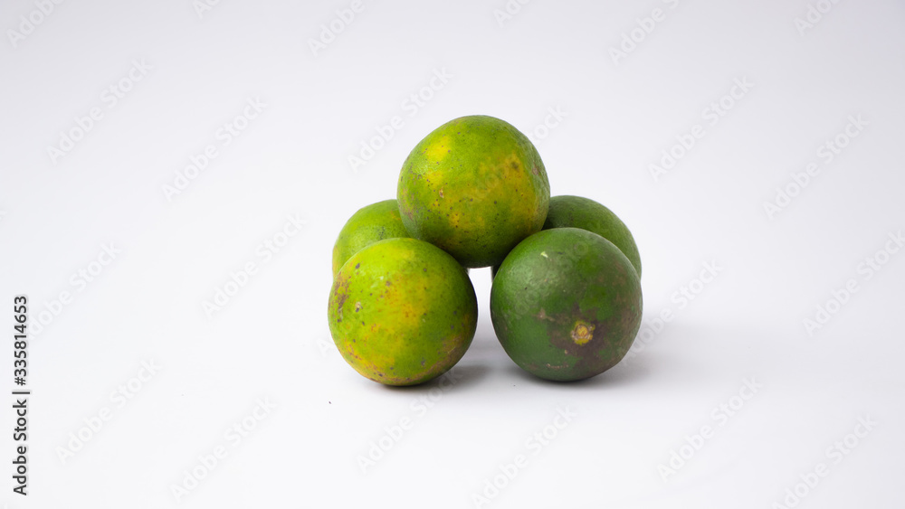 lemon lime fresh juice (Citrus Sinensis) or Jeruk nipis, isolated on white background. lemon lime fresh juice (Citrus Sinensis) or Jeruk nipis, isolated on white background.