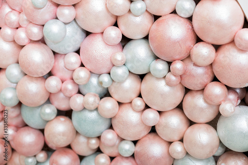 background texture of foam balloons. a wall of balloons. pink and white balloons