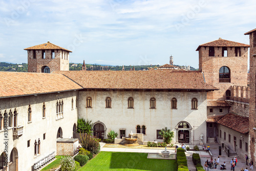View from the fortress wall to the inner courtyard, the corner tower and the tower above the entrance to Castelvecchio Castle in Verona, Italy.