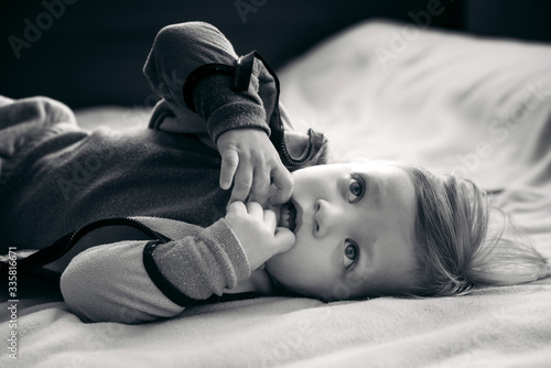 Cute Child Lying on Bed