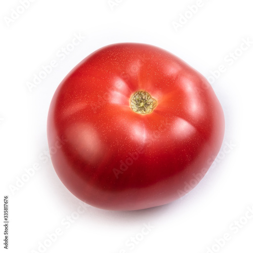 red juicy ripe tomato on a white background