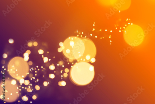 blur bokeh particles on a orange purple gradient background