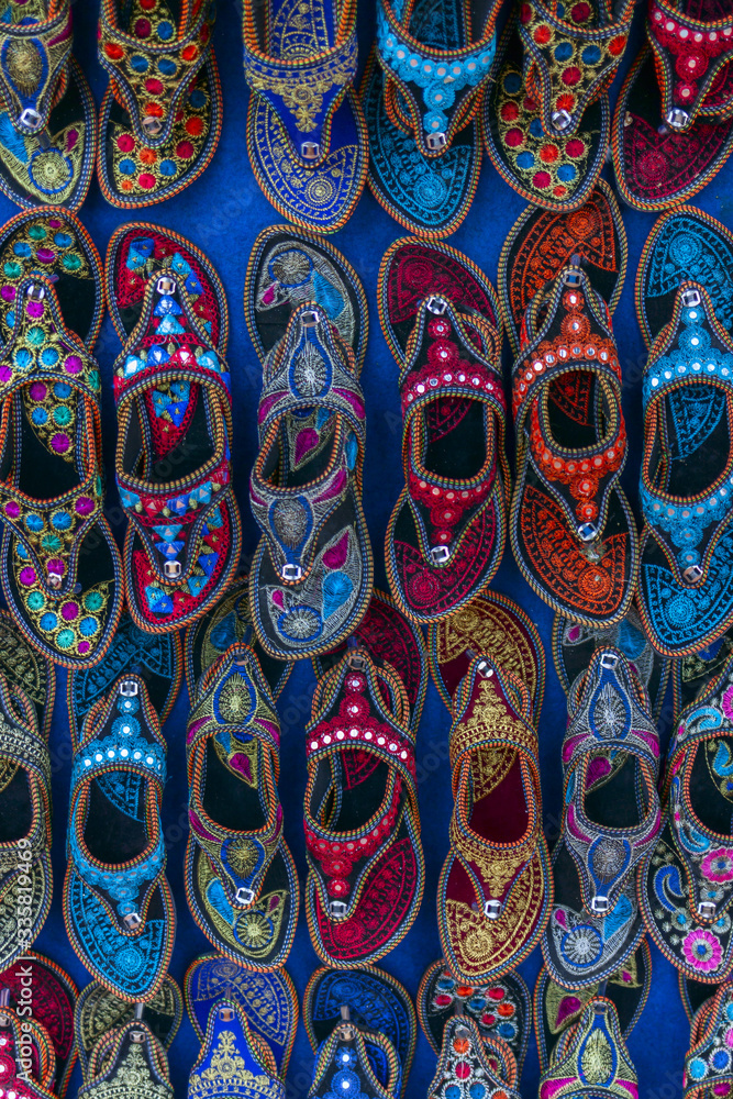 Kolhapuri Chappal- Colorful and variety of Ladies Ethnic Footwear displayed on sale at the street market in India. Kolhapuri Chappal in India are usually wore 