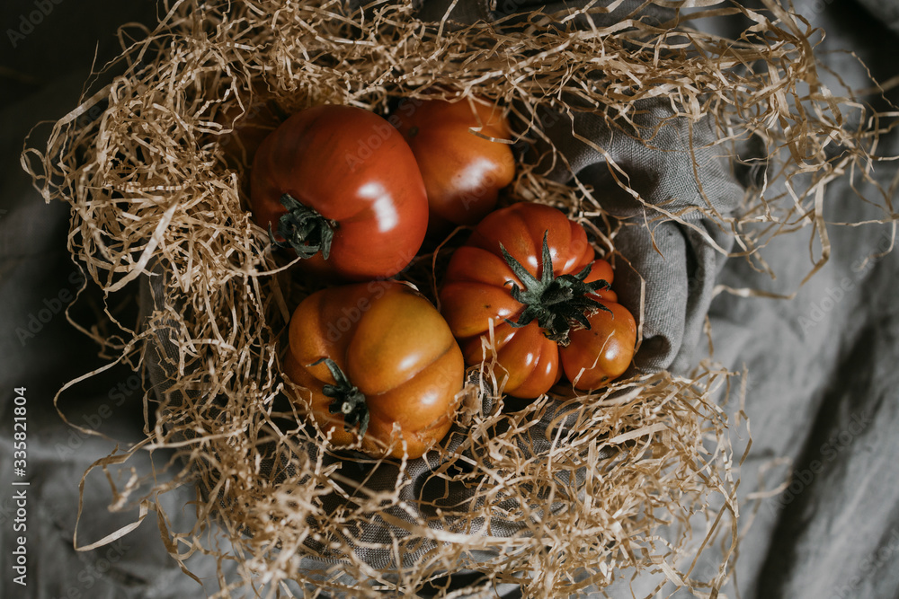 Heirloom tomatoes from the garden. Tomatoes of different classes on antique wooden surface. Assorted tomatoes Heirloom tomatoes from the garden. Tomatoes of different classes on antique wooden surface. Assorted tomatoes