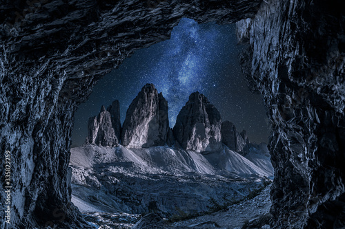 Milky way and Tre Cime di Lavaredo from cave, Dolomites