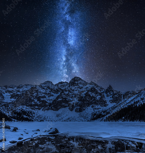 Fototapeta Naklejka Na Ścianę i Meble -  Milky way over Morskie Oko mountain lake in winter