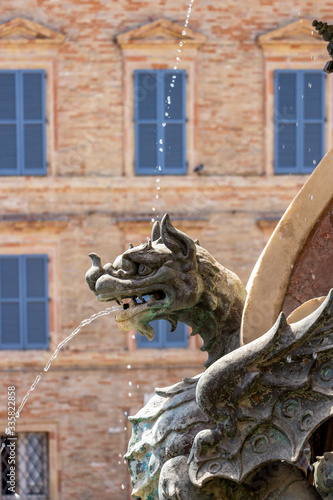Detail of the beautiful Baroque fountain Fontana Maggiore from the 17th century at Piazza della Madonna in Loreto, Ancona Province, Marche Region, Italy