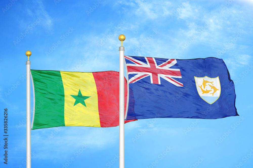Fototapeta premium Senegal and Anguilla two flags on flagpoles and blue cloudy sky