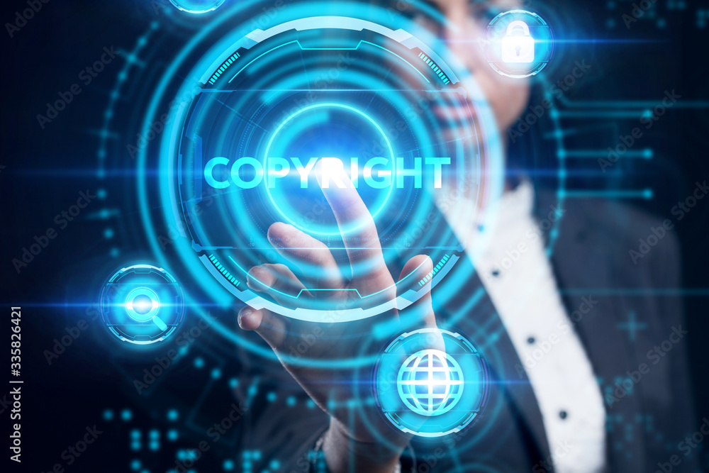 Business, Technology, Internet and network concept. Young businessman working on a virtual screen of the future and sees the inscription: Copyright Business, Technology, Internet and network concept. Young businessman working on a virtual screen of the future and sees the inscription: Copyright