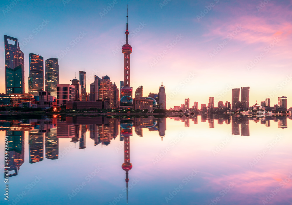 Shanghai urban architecture landscape and Huangpu River reflection in summer sunrise