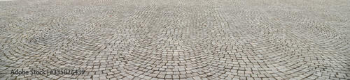 Fotografia Old cobblestone pavement close-up.