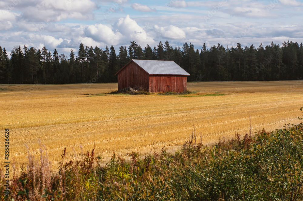 Lonely barn by the road in the Finland in fall Lonely barn by the road in the Finland in fall