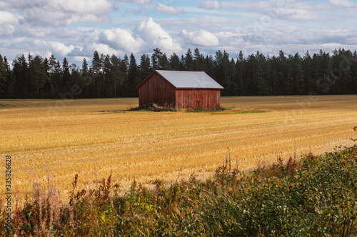 Lonely barn by the road in the Finland in fall