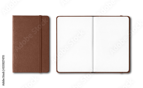 Dark leather closed and open notebooks isolated on white
