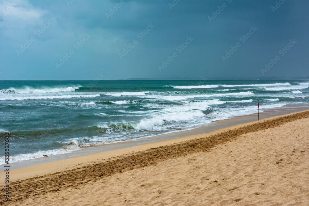 Empty or deserted Kuta Beach in Badung Regency, Bali, Indonesia. Government has been urging people to stay at home to reduce the spread of covid-19 pandemic. Tourism is hit hard with this pandemic.