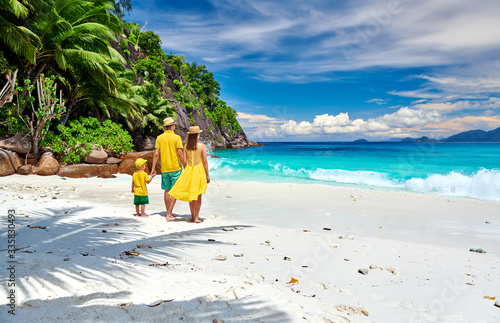 Family with three year old boy on beach. Seychelles, Mahe. © haveseen