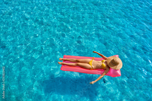 Woman relaxing on inflatable mat float © haveseen