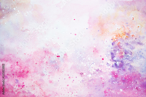 Watercolor abstract handmade background. Spray of pink golden violet and white paint.
