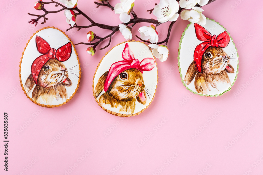 Colorful easter cookies on the pink background