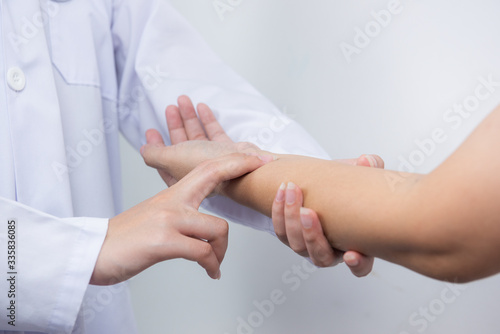 Nurse is checking patient's pulse, medical checking on white background