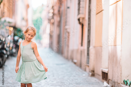 Adorable fashion little girl outdoors in European city Rome