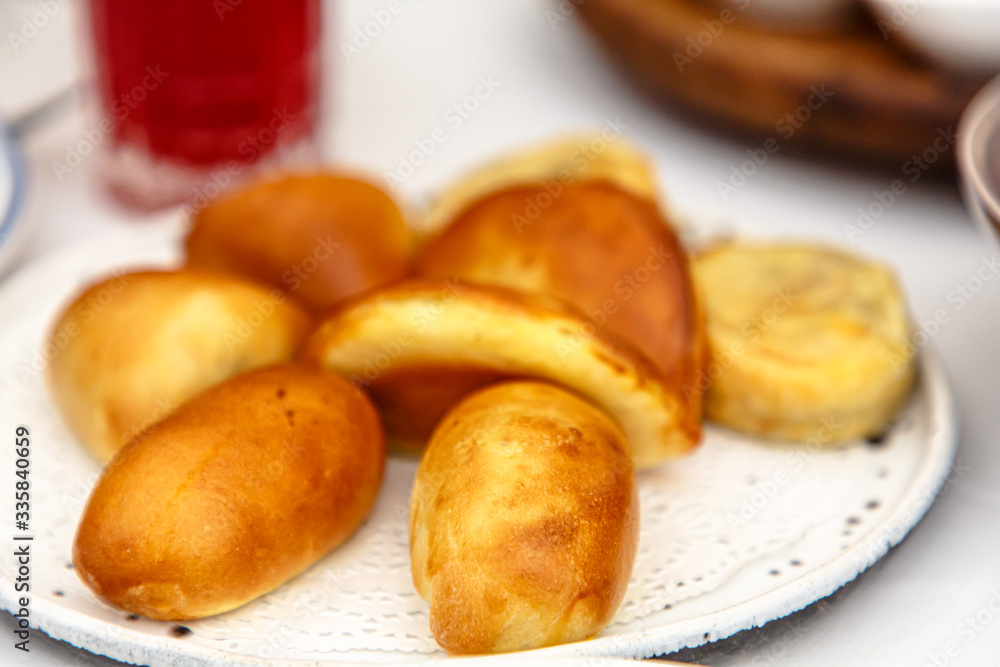 Different pies with different fillings are on the plate. Different pies with different fillings are on the plate.