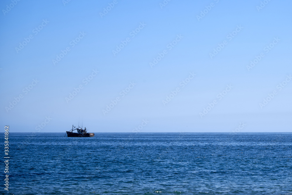 small boat in the ocean                 