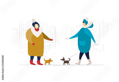 Housemates walk with dogs near the house. Winter season
