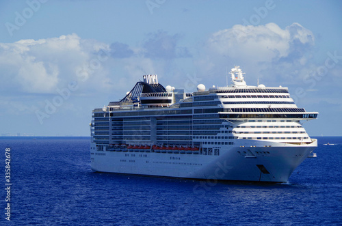 Huge modern MSC Cruises cruiseship or cruise ship liner MSC Divina at sea in summer during Caribbean cruising dream vacation	 photo
